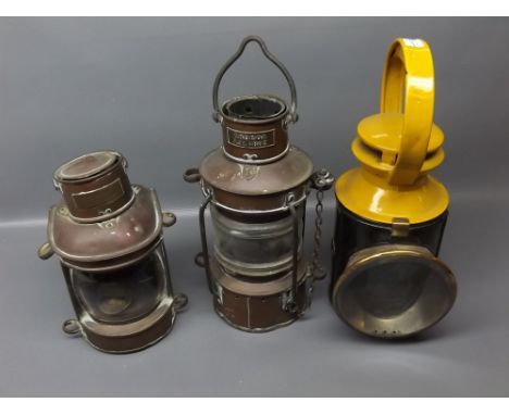 Painted railway lamp and two vintage ship's lamps  
