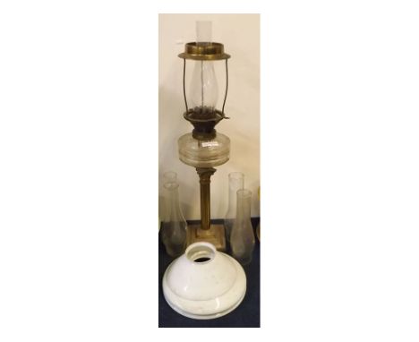 Victorian Corinthian column brass oil lamp, with clear glass font together with two opaque glass shades and two funnels, lamp