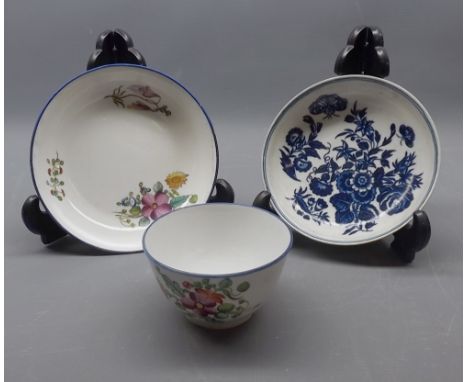 19th century New Hall cup and saucer with floral decoration, together with a further 19th century Worcester floral and butter