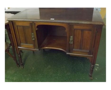 Edwardian walnut sideboard, fitted with open shelf, two panelled reeded doors either side, ringlet handles, supported on four