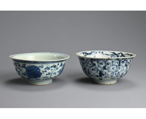 TWO CHINESE PORCELAIN MING DYNASTY BLUE AND WHITE BOWLS. The first painted with lotus flowers amongst scrolling tendrils and 