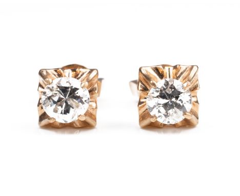 A PAIR OF HIGH CARAT ROSE GOLD DIAMOND STUD EARRINGS,&nbsp;MID 20TH CENTURY. Single round cut diamonds in foliate mounts. Unm