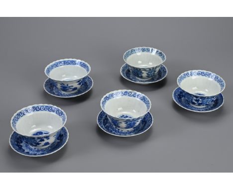 A SET OF TEN CHINESE BLUE AND WHITE PORCELAIN CUPS AND SAUCERS, LATE QING DYNASTY. Ten lobed cups and saucers decorated with 