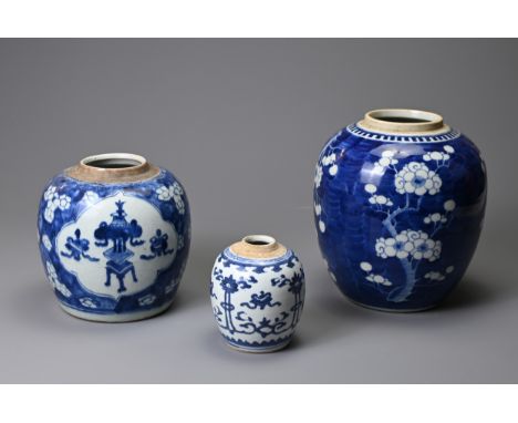 THREE CHINESE PORCELAIN BLUE AND WHITE GINGER JARS, KANGXI (1661-1722) AND LATER. Comprising: a small oviform jar painted wit