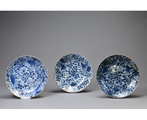 THREE CHINESE PORCELAIN KANGXI (1661-1722) BLUE AND WHITE PEONY PATTERN DISHES, each with seal mark, painted with flowering p