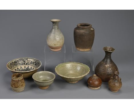 A GROUP OF SOUTH EAST ASIAN POTTERY VASES AND BOWLS. Including: a 19th century Thai or Vietnamese bowl decorated with dark bl