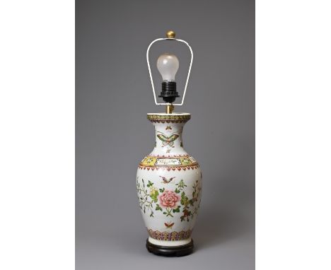 A 20TH CENTURY CHINESE PORCELAIN OVIFORM FAMILLE ROSE VASE ADAPTED AS A LAMP. Painted with butterflies, peony, fruits and flo