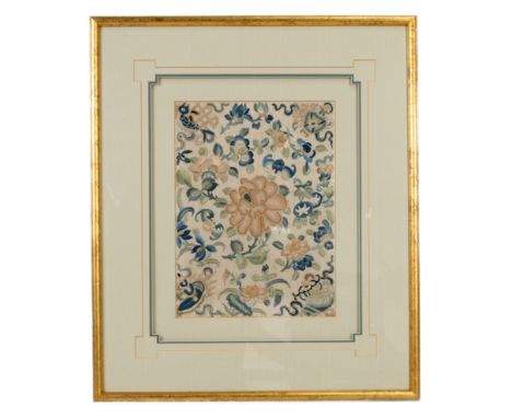 A CHINESE EARLY 20TH CENTURY FRAMED SILK EMBROIDERY. Depicting a pink peony flanked by bats, flowers and fruit, each corner w