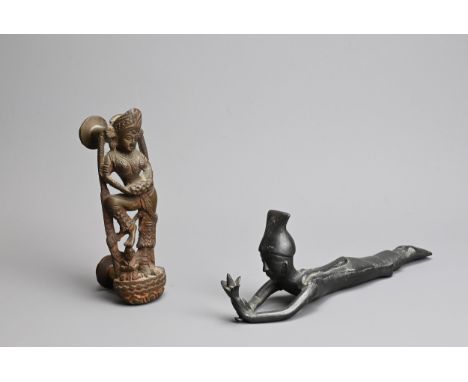 TWO SOUTH EAST ASIAN CAST METAL ITEMS OF DOOR FURNITURE. Comprising: a door handle in the form of a dancing Buddhist female d