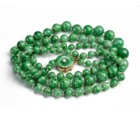 A GRADUATED JADE BEAD NECKLACE WITH 14CT GOLD CLASP WITH SINGLE DIAMOND. Marked 14K. Length 76cm. Beads Between 4mm and 10mm.
