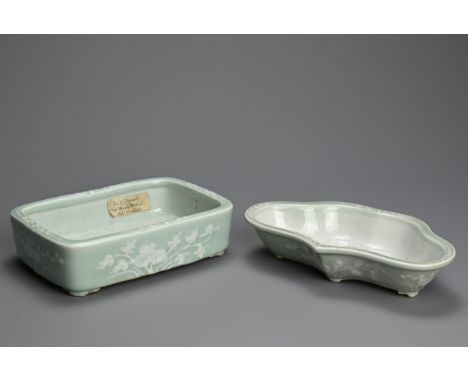 TWO CHINESE SLIP DECORATED CELADON GROUND PORCELAIN NARCISSUS BOWLS, 19TH CENTURY. of lobbed and rectangular form decorated w