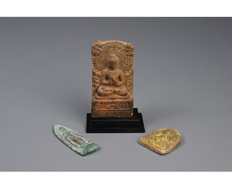 AN INDIAN BHIMA TERRACOTTA TEMPLE STELE AND TWO OTHERS.  The first moulded with a seated Buddha before the wheel of Dharma fl