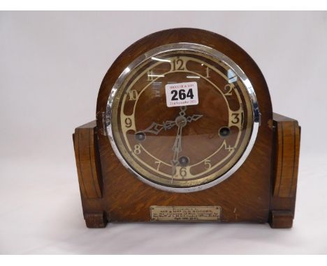 Oak cased mantel clock with presentation label