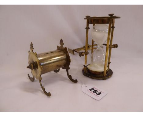 Trench art brass money box and a brass cased  half hour glass or egg timer on swivel bracket (2)
