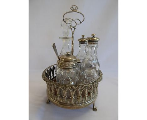 Silver condiments stand, silver topped bottles etc.