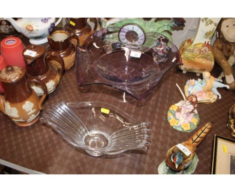 An amethyst glass bowl; and a clear glass dish