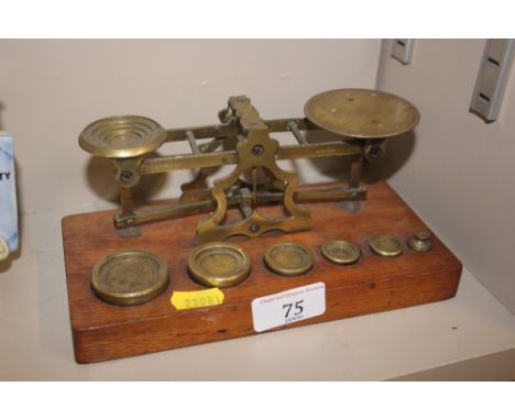 A set of oak and brass postal scales 