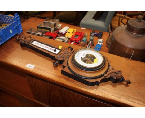 A walnut cased barometer