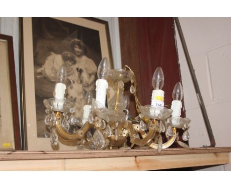 A brass and glass eight branch chandelier 