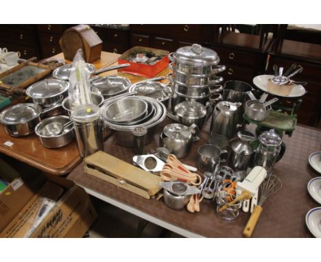 A large quantity of stainless steel kitchenalia; and a set of kitchen scales etc. 