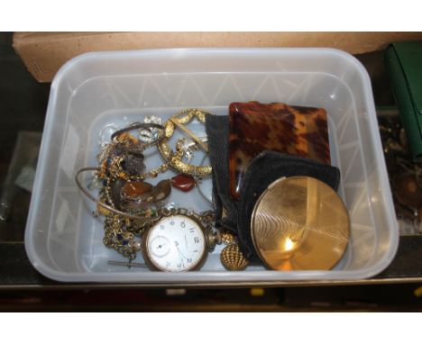 A box containing various costume jewellery, a compact, a pocket watch etc. 