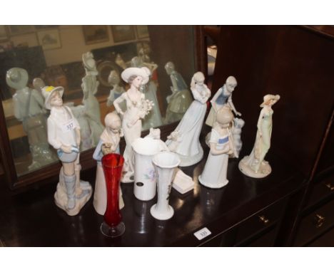 A quantity of various decorative figurines; a red glass vase etc.