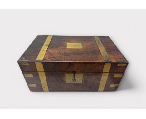 A Victorian walnut and brass bound writing slope with glass inkwell,  pen tray and key. Sold AF. 40cm x 24.5cm x 17cm.