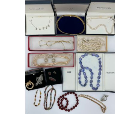 A mixed selection of jewellery including a graduated pearl necklace with silver clasp, a silver and mother of pearl bead neck
