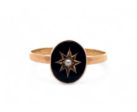 A 22ct gold, black enamel and seed pearl ring. Size O. Date marks rubbed.