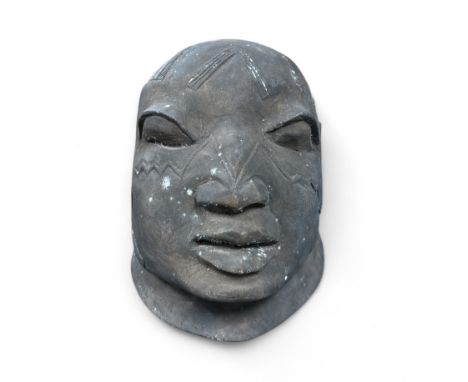 An early to mid 20th century carved wood Makonde African helmet Mask, hollow interior, some deterioration to the wood. Height