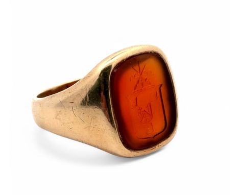 A  gold family crest carnelian intaglio ring, stamped 9ct. Size S. Carnelian approx 15mm x 12.5mm. 8.26g.