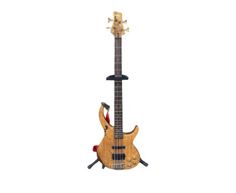 Vintage Bass Guitar - Patterened solid wood design. Comes with stand and strap. A few scratches and dents visible (see photos