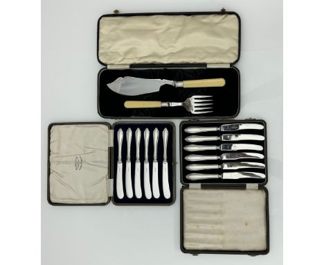 A cased set of six knives with filled silver handles and stainless steel blades by Viners Sheffield 1949. A cased set of six 