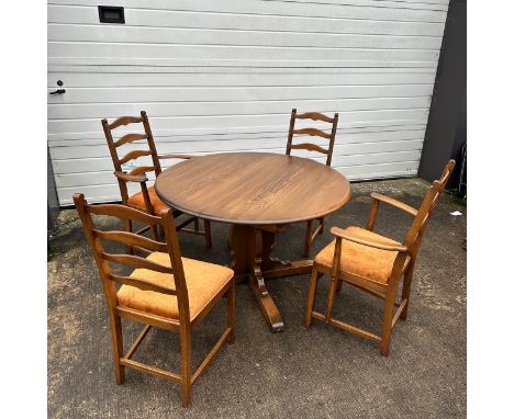 Ercol Elm Circular Dining Table with Four Chairs. Elm circular table with additional leaf's to extend the table. On a centre 