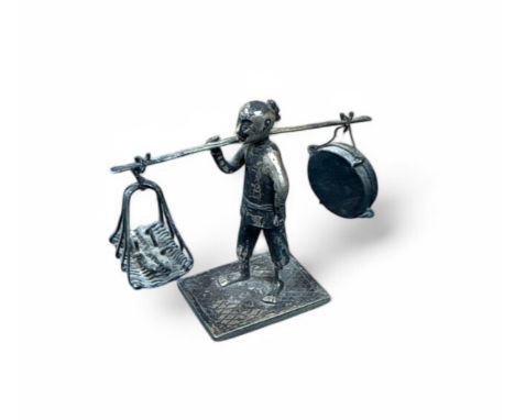 A late 19th century miniature Chinese export silver figure, by Wang Hing, Canton, a man carrying items on his shoulder. Hallm