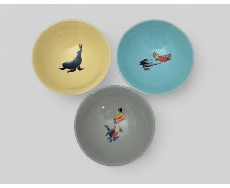 Guinness, set of three colourful Wade Advertising Dishes. Includes; Blue with Pelican motif, Yellow with Seal Motif and Grey 