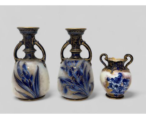 Royal Doulton: A pair of Royal Doulton Burslem Blue Iris amphora vases with gilded decoration, approx 14cm high. Circa 1900, 