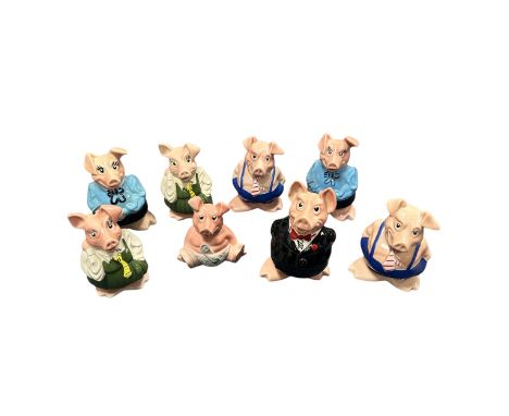 Eight Wade Piggy Banks. Eight ceramic Wade piggy banks/ pig money boxes, each marked to the bottom for Wade England, and havi