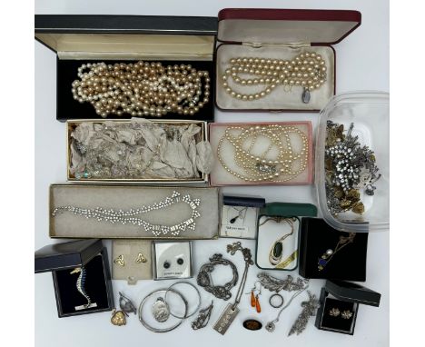 A quantity of silver and costume jewellery. To include a silver ingot necklace, gold plated nephrite jade necklace, silver an