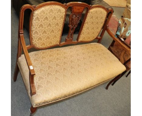 A late Victorian/Edwardian sofa upholstered in cream fabric 