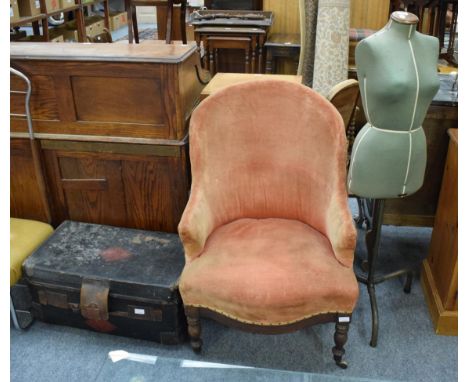 A French (1880) armchair with rust coloured upholstery; a retro Singer dress makers mannequin; and an original leather boardi