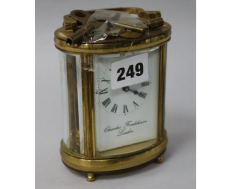 Charles Frodsham. An oval brass carriage clock