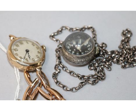 A lady's 1930's 9ct gold Buren manual wind wrist watch and a later globe watch pendant on chain.