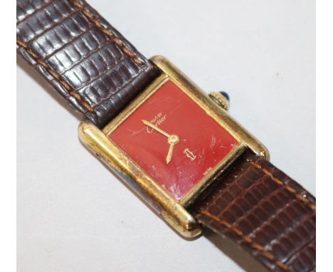 A lady's silver gilt Must de Cartier manual wind wrist watch.