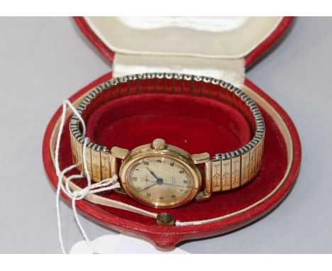 A gentleman's boy's size 1930's 9ct gold Omega manual wind wrist watch, on associated strap.