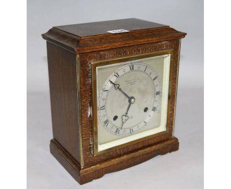 An Elliott oak mantel clock