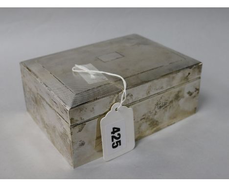 A 1960's engine turned silver cigarette box, 6.25in.