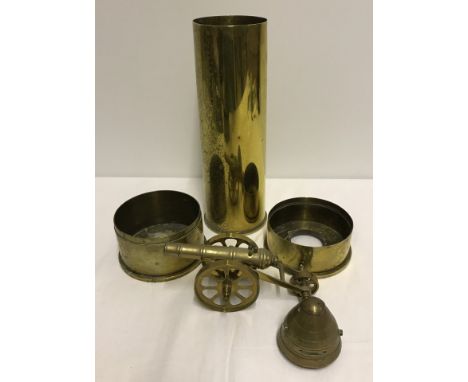 Collection of brass shell cases , shell cone timer and model brass canon.  