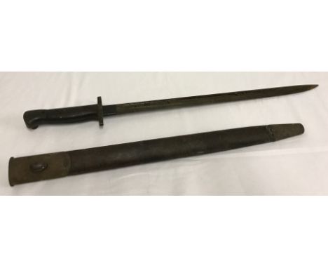A 1907 British bayonet & leather scabbard. Blade marked Wilkinson & dated 1907. 