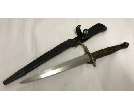 Airborne and SAS interest. Fairbairn Sykes fighting knife dated 1945 with Scabbard. With attached Dog tag to "Unsworth". 
